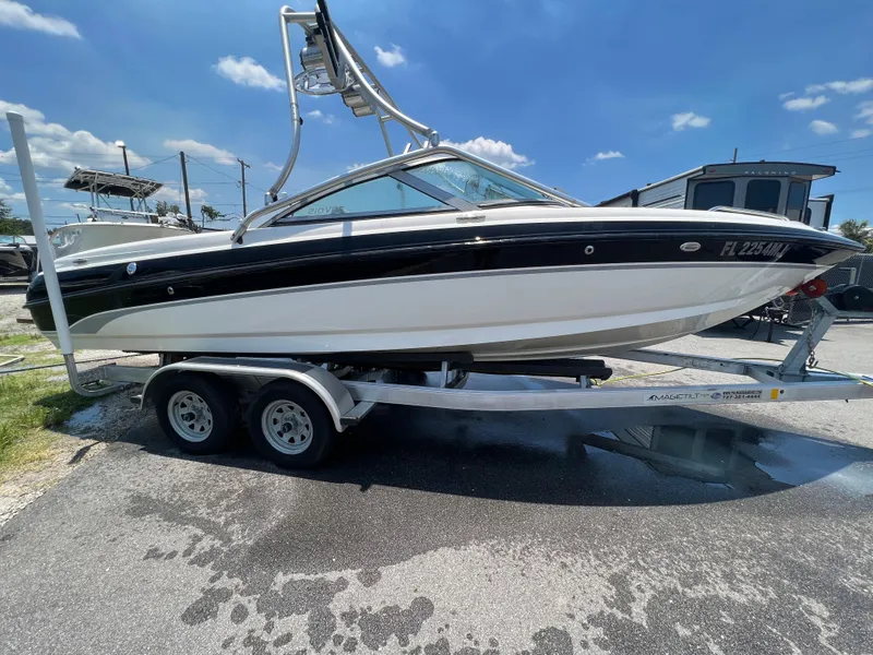 Slide: The Image of 2004 MasterCraft MariStar 210 VRS boat on trailer under clear blue sky. - 6