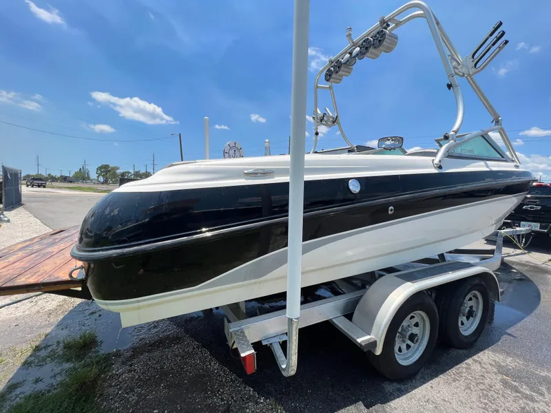 Slide: The Image of 2004 MasterCraft MariStar 210 VRS boat on trailer under clear blue sky. - 7