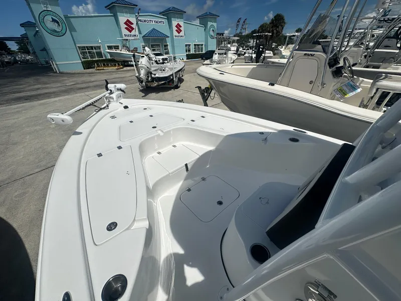 Slide: The Image of 2025 Sea Pro 230 Bay boat displayed at Palm City Yachts dealership. - 6