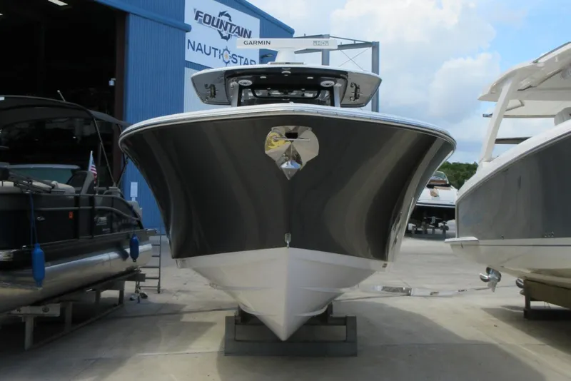 Slide: The Image of 2021 Sportsman Open 352 Center Console boat in marina, front view. - 10