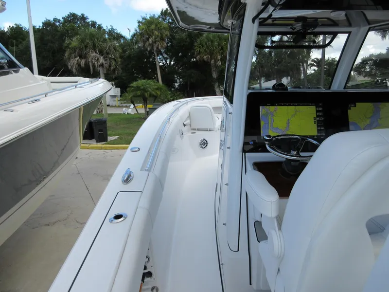 Slide: The Image of 2021 Sportsman Open 352 Center Console boat with advanced navigation system and sleek design. - 13