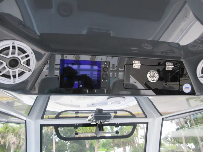Slide: The Image of 2021 Sportsman Open 352 Center Console dashboard with speakers and control panel. - 15