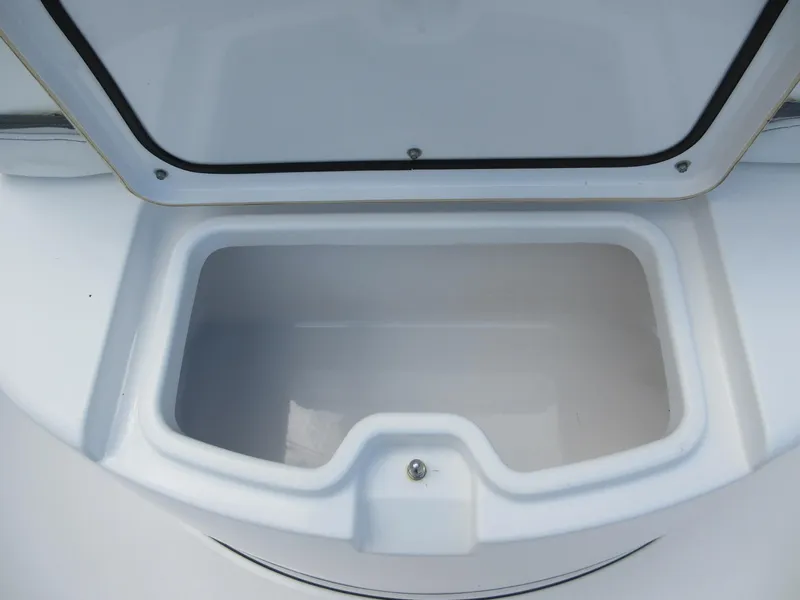 Slide: The Image of Open storage compartment on 2021 Sportsman Open 352 Center Console boat. - 16