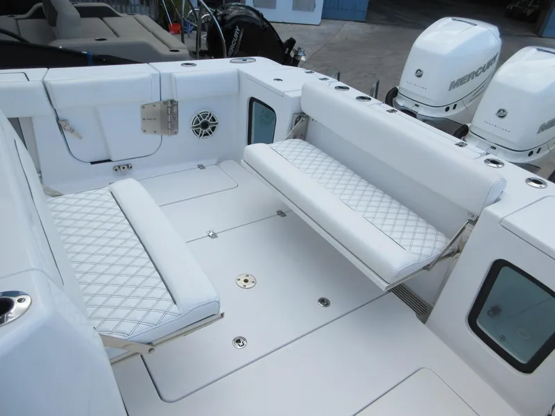 Slide: The Image of 2021 Sportsman Open 352 Center Console with white seating and Mercury engines. - 25