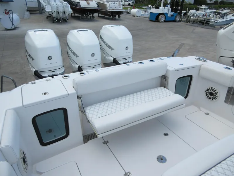 Slide: The Image of 2021 Sportsman Open 352 Center Console with quad Mercury engines and white seating. - 26