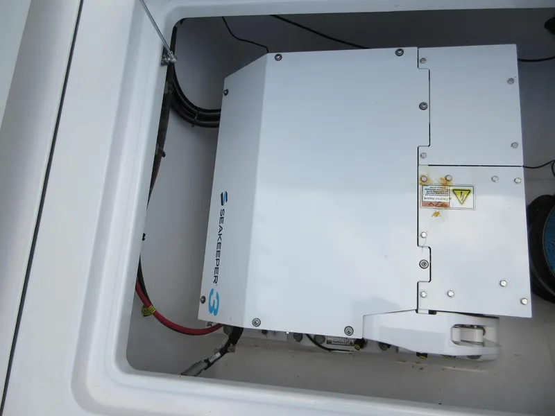 Slide: The Image of Seakeeper 3 stabilizer in 2021 Sportsman Open 352 Center Console boat compartment. - 27