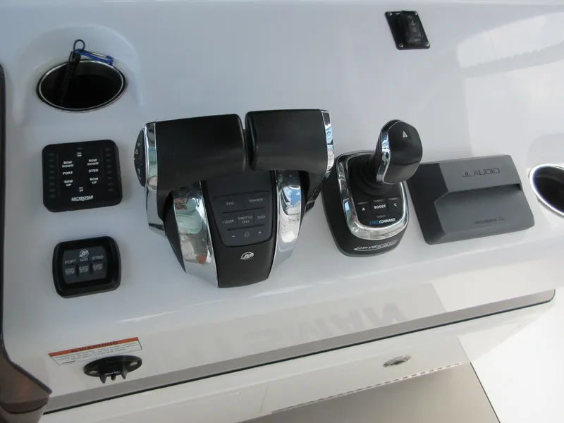 Slide: The Image of Control panel of 2021 Sportsman Open 352 Center Console boat with throttle and joystick. - 29