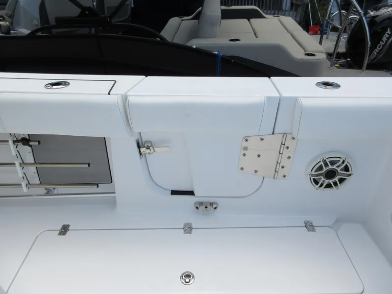 Slide: The Image of 2021 Sportsman Open 352 Center Console boat interior with storage compartments and speaker. - 30