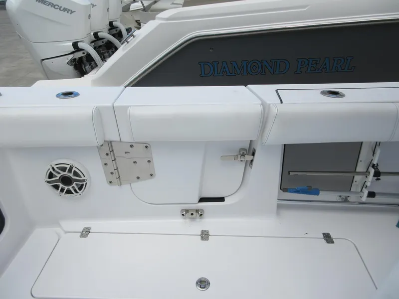 Slide: The Image of 2021 Sportsman Open 352 Center Console boat interior with seating and speaker. - 31