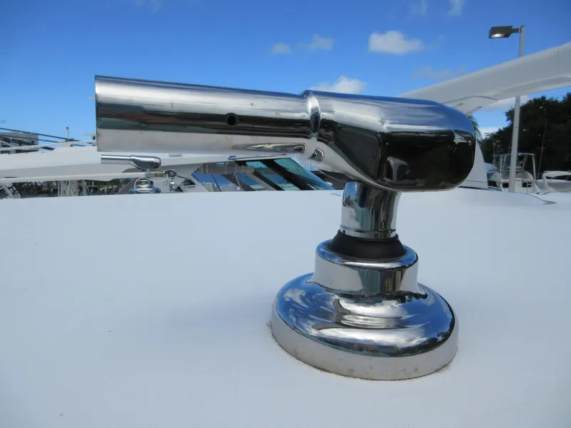 Slide: The Image of Chrome fitting on 2021 Sportsman Open 352 Center Console boat under blue sky. - 32