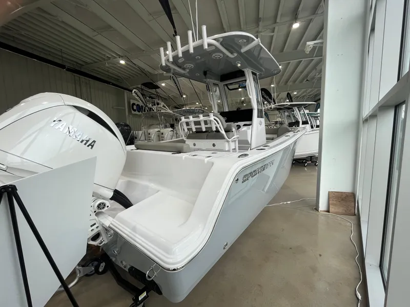 Slide: The Image of 2025 Sportsman Open 212 Center Console boat displayed indoors with Yamaha engine. - 15