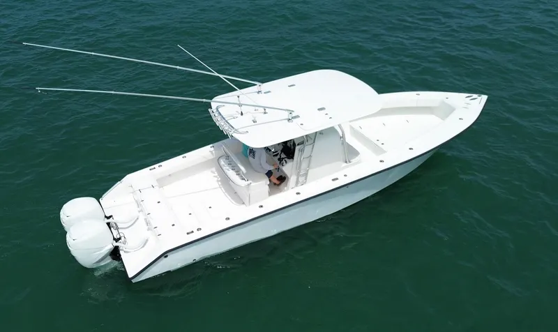 Slide: The Image of 2006 Venture 34 Open boat with dual engines on calm water. - 11