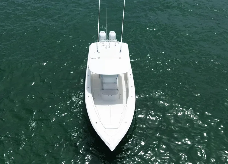 Slide: The Image of 2006 Venture 34 Open boat on calm water, aerial view. - 12