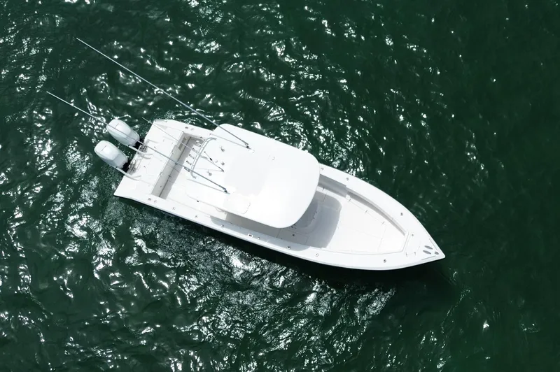Slide: The Image of Aerial view of 2006 Venture 34 Open boat on green water. - 13