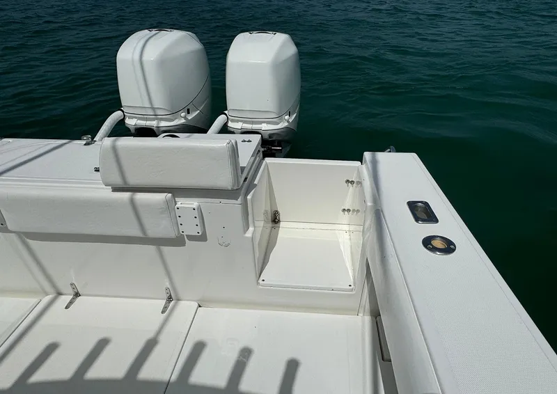 Slide: The Image of 2006 Venture 34 Open boat with dual engines on calm water. - 19