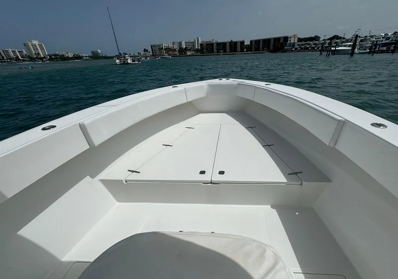 Slide: The Image of 2006 Venture 34 Open boat deck with ocean and coastal buildings in the background. - 22