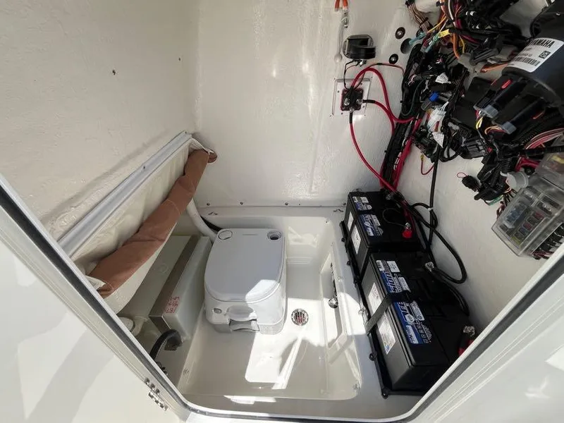 Slide: The Image of 2025 Key West 239 FS boat interior with batteries and wiring. - 15