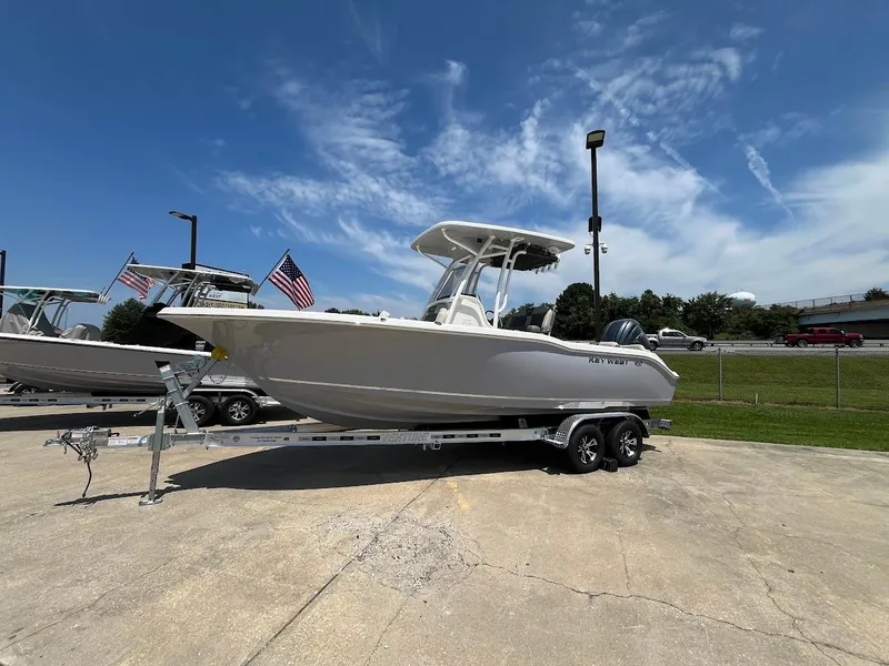 Slide: The Image of 2025 Key West 239 FS boat on trailer under clear blue sky. - 3