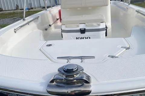 Slide: The Image of 2025 Boston Whaler 150 Montauk boat interior with Igloo cooler and seating. - 2