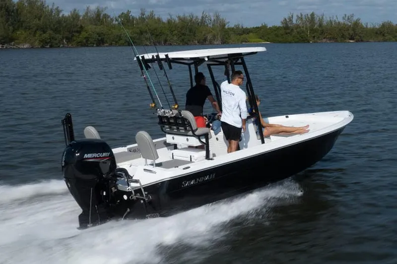 Slide: The Image of 2025 Savannah 210X boat with Suzuki engine on trailer in parking lot. - 3