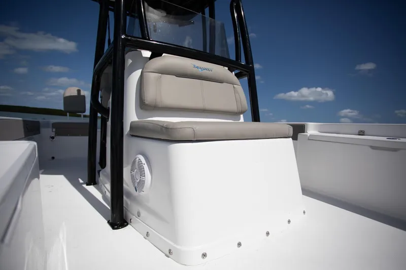 Slide: The Image of Open storage compartment on 2025 Savannah 210X boat, featuring cushioned seating. - 6