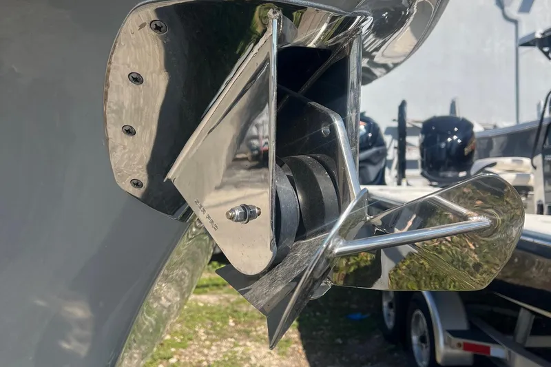 Slide: The Image of Close-up of a 2024 Sea Pro 242 Center Console boat's propeller and trim tab. - 5