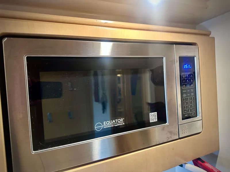 Slide: The Image of Stainless steel Equator microwave in a 1997 Carver 350 Mariner yacht kitchen. - 29