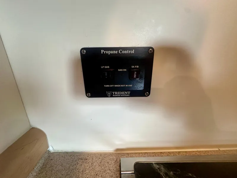 Slide: The Image of Propane control panel on 1997 Carver 350 Mariner boat interior. - 31