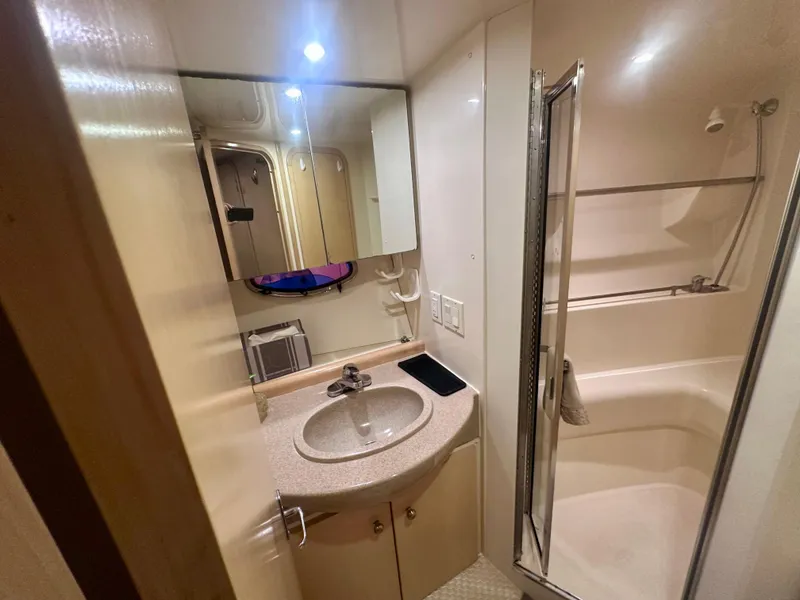 Slide: The Image of Bathroom interior of 1997 Carver 350 Mariner yacht with sink and shower. - 36
