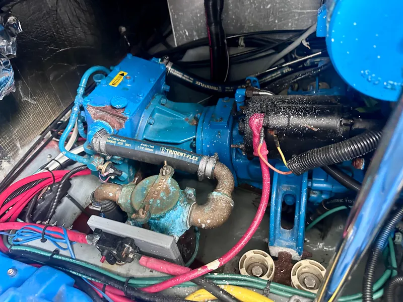 Slide: The Image of Engine compartment of a 1997 Carver 350 Mariner with visible wiring and components. - 43