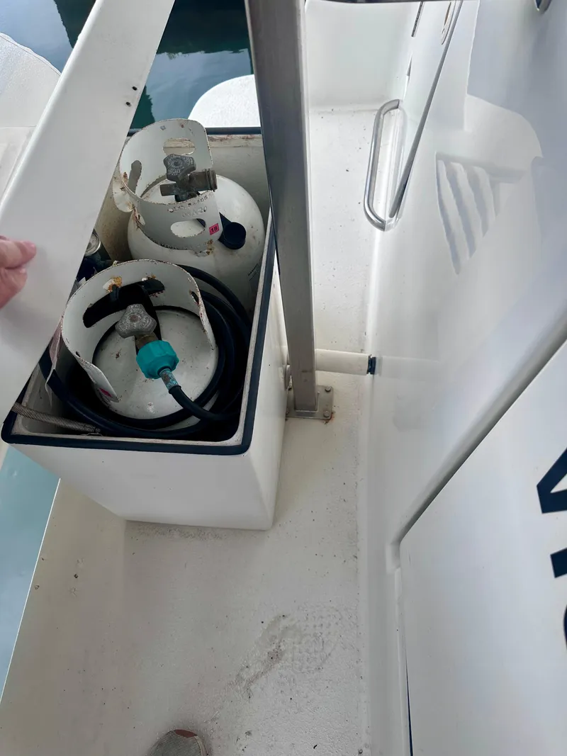 Slide: The Image of Propane tanks in storage compartment on 1997 Carver 350 Mariner boat. - 46