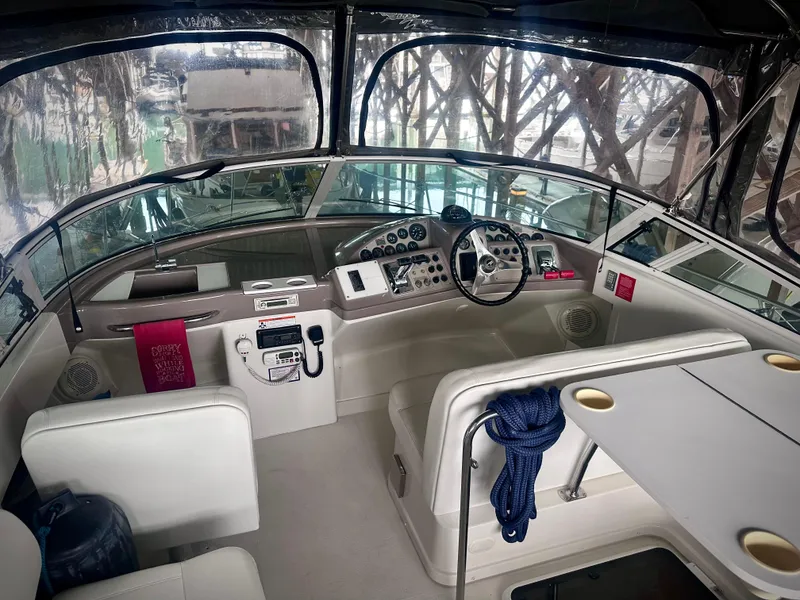 Slide: The Image of 1997 Carver 350 Mariner boat interior with helm, seating, and navigation equipment. - 9