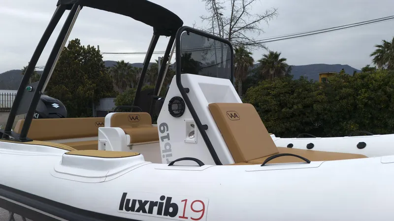 Slide: The Image of 2025 Aqvaboats Luxrib 19 inflatable boat with tan seating and modern design. - 14