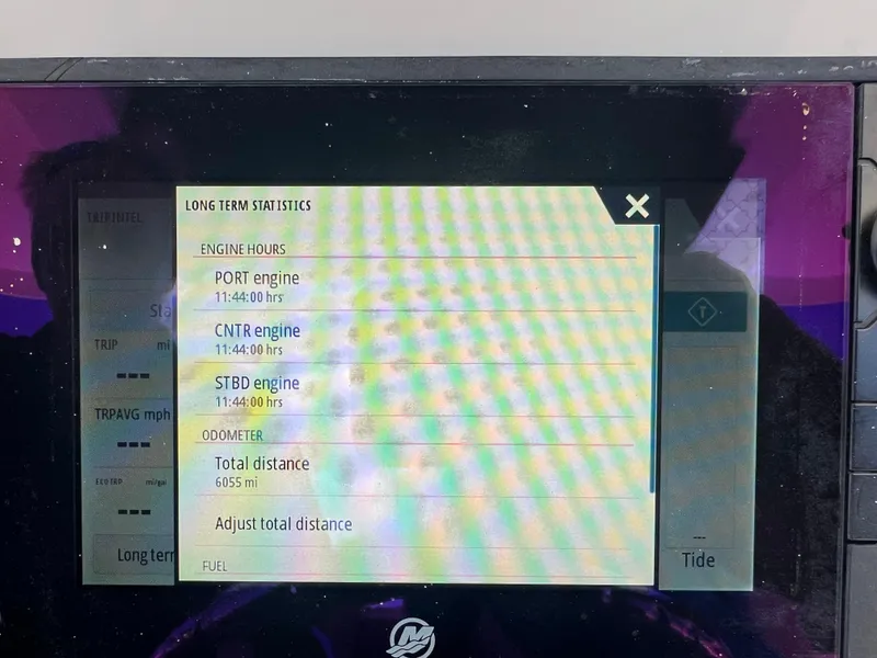 Slide: The Image of Display screen showing engine hours and odometer for 2017 Boston Whaler 350 Outrage. - 14