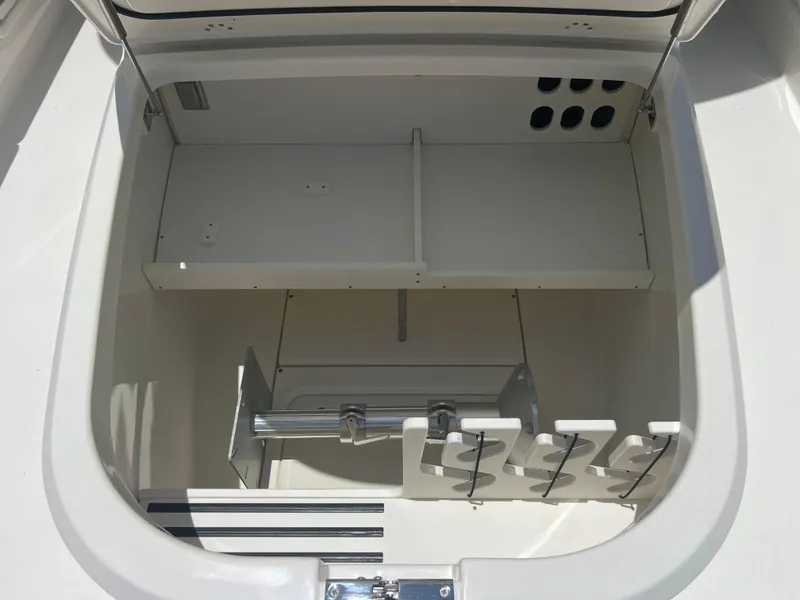 Slide: The Image of 2017 Boston Whaler 350 Outrage storage compartment, open and empty, showcasing interior design. - 19