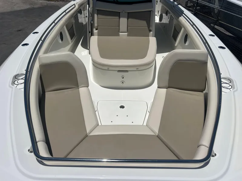 Slide: The Image of 2017 Boston Whaler 350 Outrage boat interior with beige seating and spacious layout. - 22