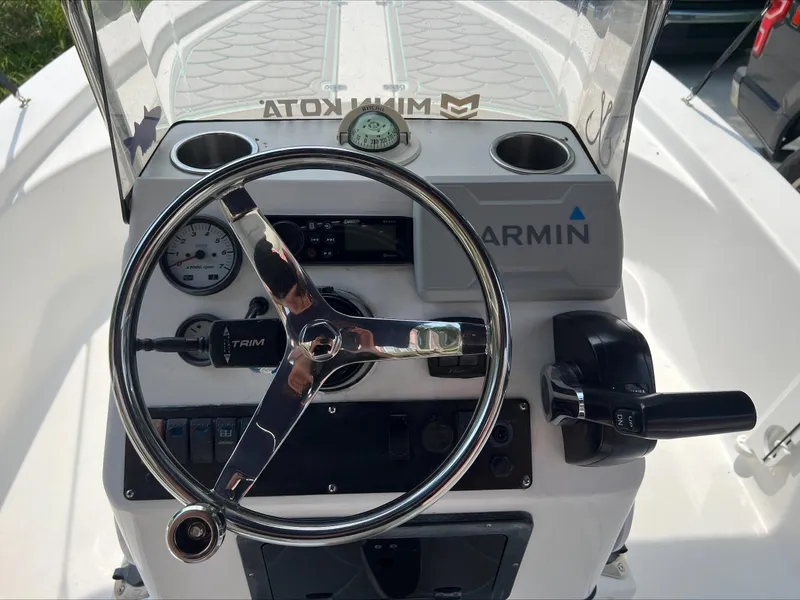 Slide: The Image of Steering console of 2016 Sportsman Island Bay 18 boat with Garmin equipment. - 10