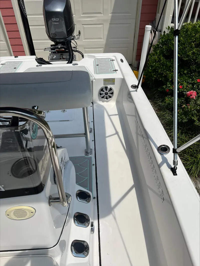 Slide: The Image of 2016 Sportsman Island Bay 18 boat interior with Yamaha 90 engine, parked near garage. - 13