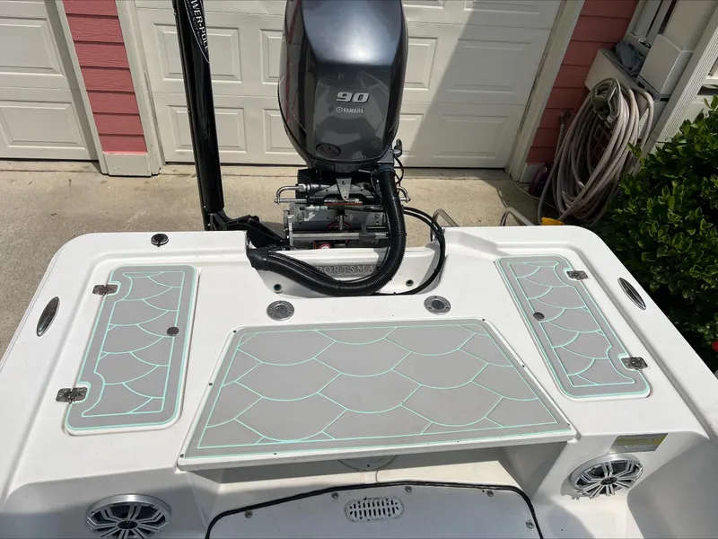 Slide: The Image of 2016 Sportsman Island Bay 18 boat with Yamaha 90 engine, docked near garage. - 15
