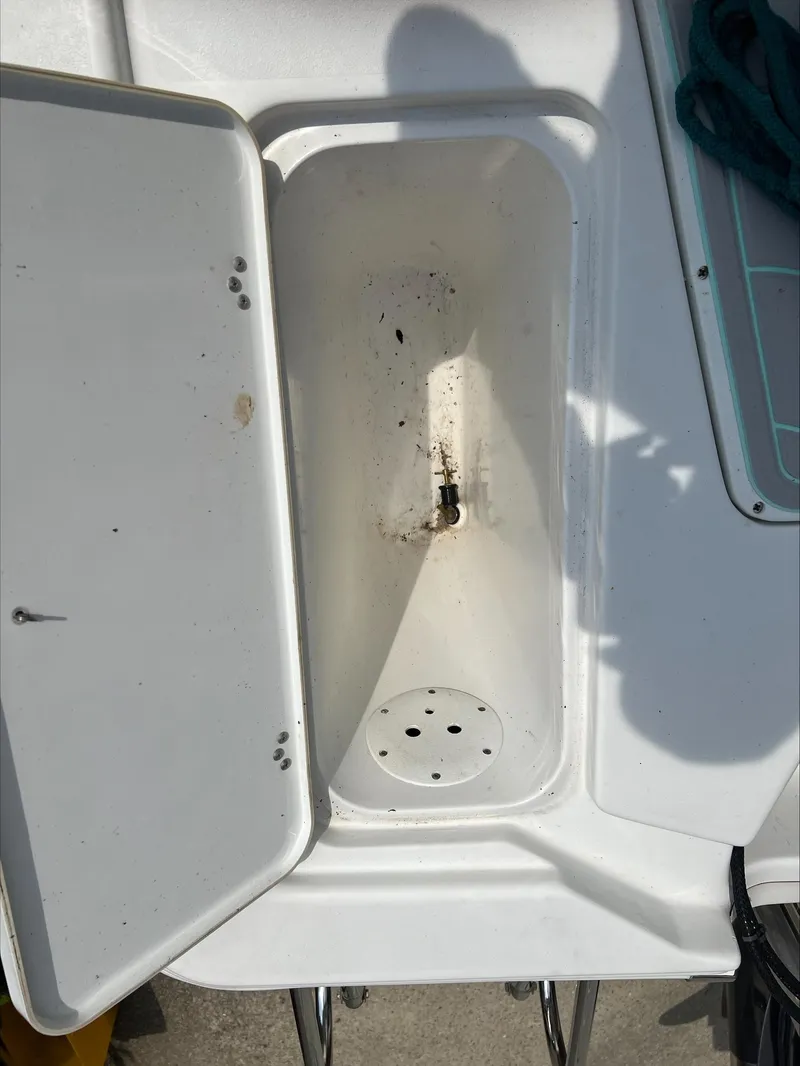 Slide: The Image of Open storage compartment on 2016 Sportsman Island Bay 18 boat. - 17
