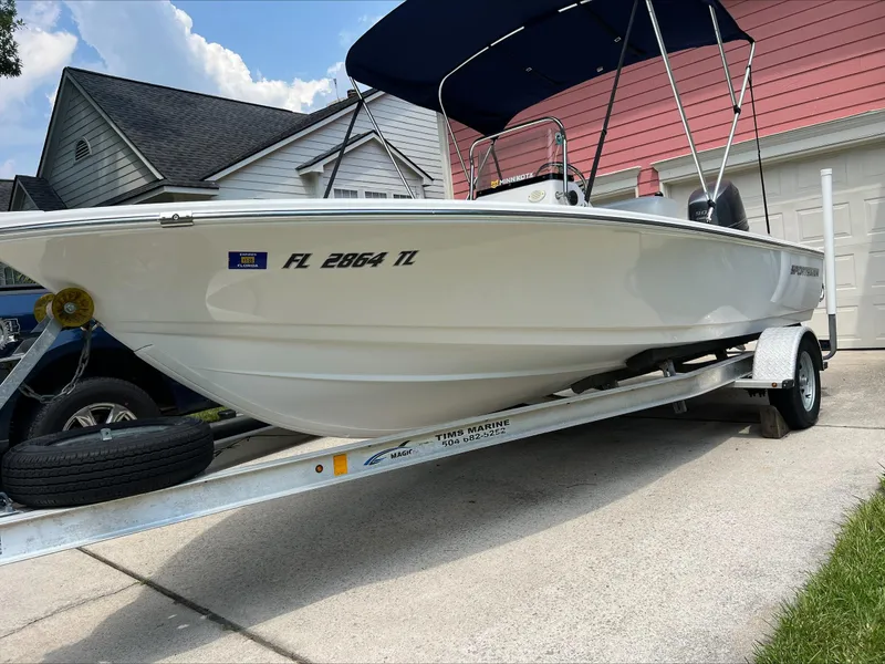 Slide: The Image of 2016 Sportsman Island Bay 18 boat on trailer, parked in driveway. - 2