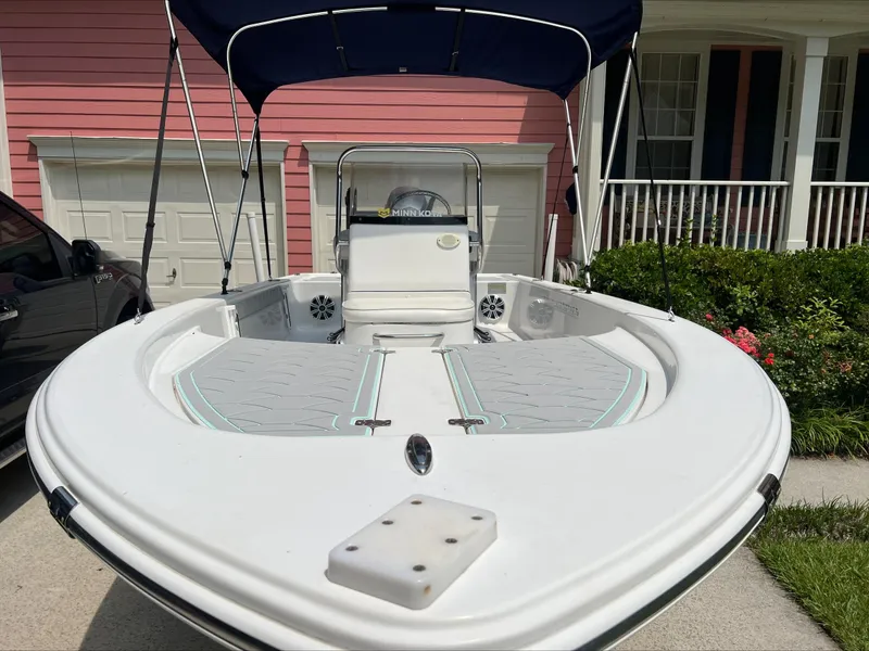 Slide: The Image of 2016 Sportsman Island Bay 18 boat with canopy, parked in driveway. - 8