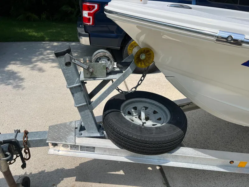 Slide: The Image of Trailer hitch with spare tire for 2016 Sportsman Island Bay 18 boat. - 9