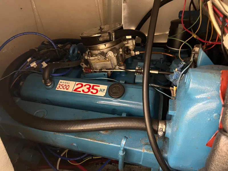 Slide: The Image of 1974 Chris-Craft Dory engine, Model 350Q, 235 horsepower, blue with visible wiring. - 27