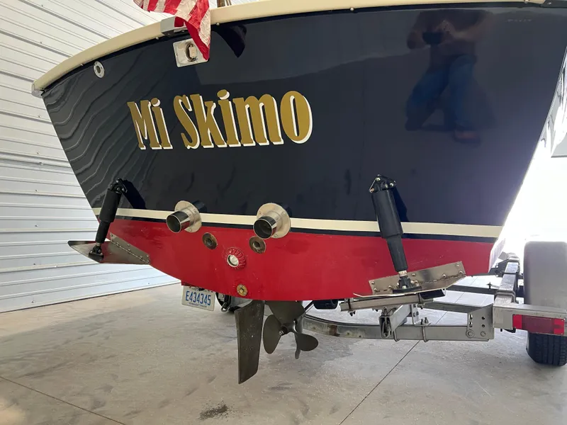 Slide: The Image of 1974 Chris-Craft Dory boat named "Mi Skimo" on trailer in garage. - 6