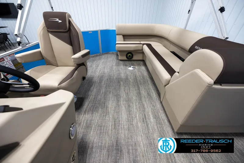 Slide: The Image of Interior of 2025 Bennington 21 SL pontoon boat with beige seating and modern design. - 13