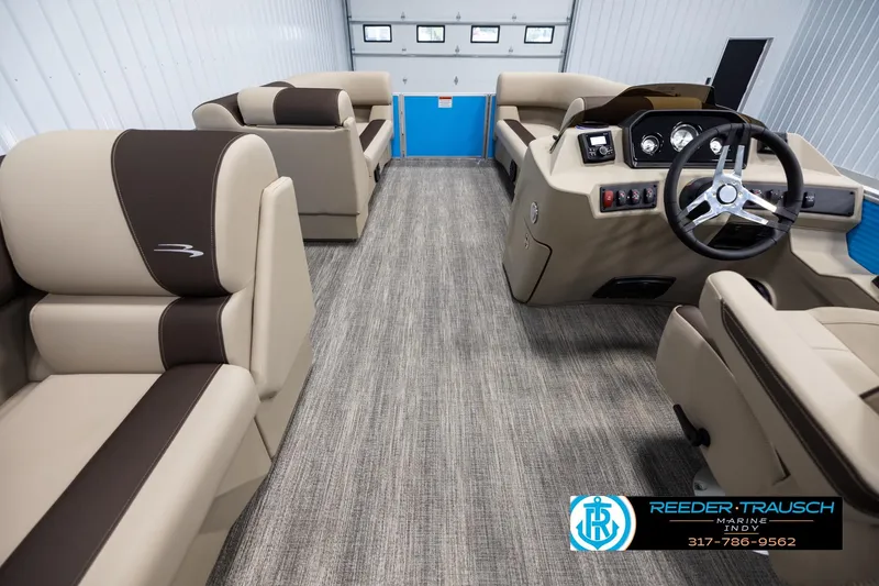Slide: The Image of Interior of 2025 Bennington 21 SL pontoon boat with beige and brown seating. - 16