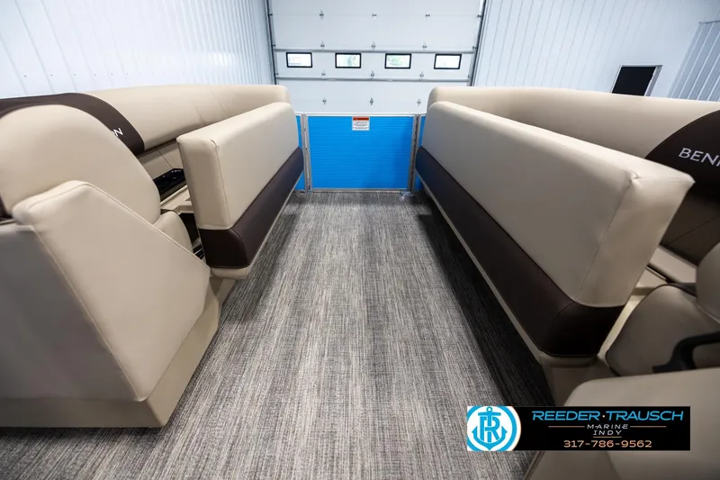 Slide: The Image of Interior of 2025 Bennington 21 SL pontoon boat with beige seating and carpeted floor. - 18