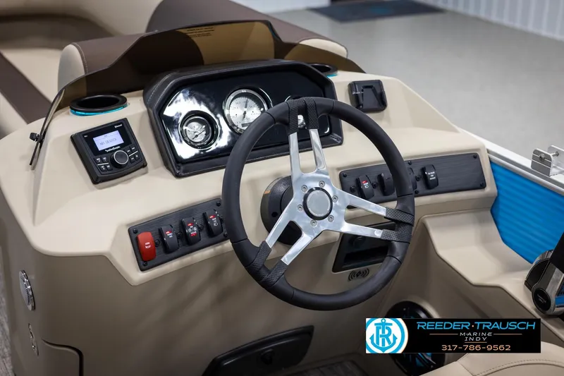 Slide: The Image of 2025 Bennington 21 SL boat dashboard with steering wheel and control panel. - 23