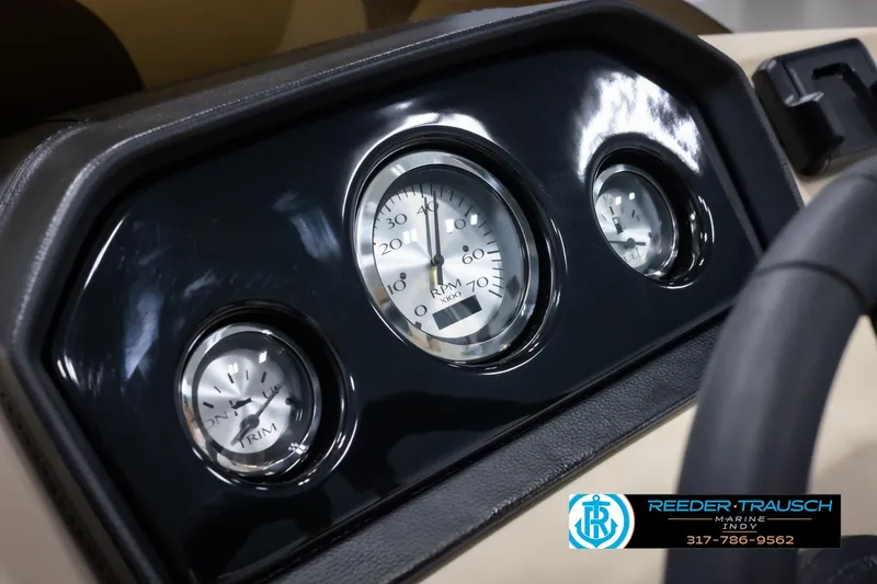 Slide: The Image of Dashboard of 2025 Bennington 21 SL boat with gauges and steering wheel. - 28